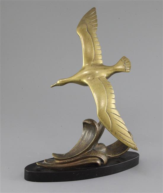 A. Leger. An Art Deco bronze model of a seagull flying over waves, 11.5in.